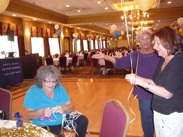 Phyllis Harris Boyd and Liliane Straussman McClenning getting the ribbons ready for the balloons.