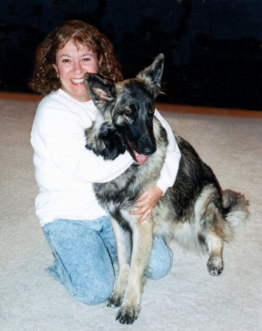 Susan Sacket.  This picture was taken about 8 years ago, but its one of my favorites -- me, with my beautiful dog Summer, a Shiloh Shepherd (related to German Shepherds).